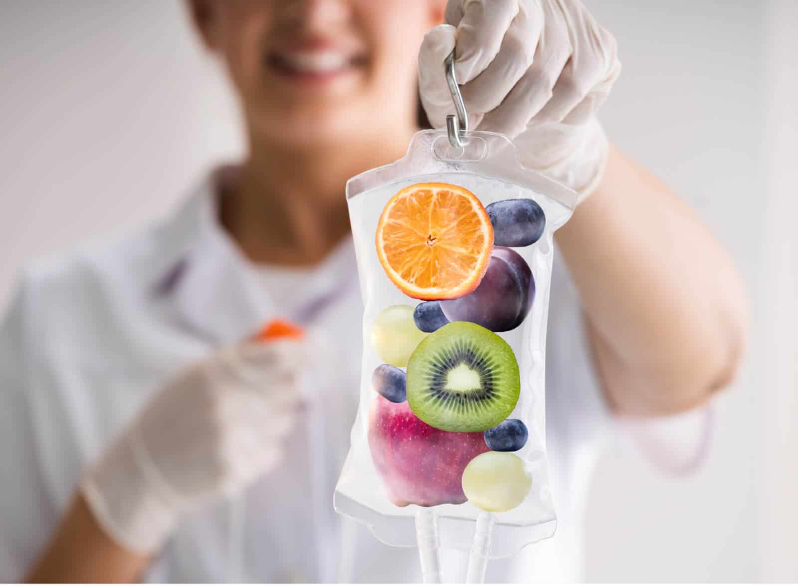 Doctor Holding Fruit IV Bag | Injex Aesthetics and Wellness in San Marcos, CA